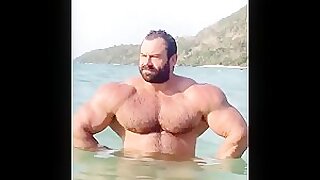 IFBB Pro bodybuilder Mikhail Maslov at the beach