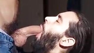 Bearded guy worshipping big white dick on his knees