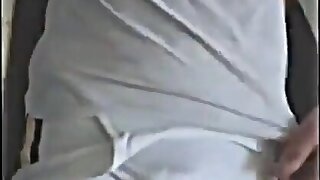 Fat cock wrestler walks around meet in white singlet