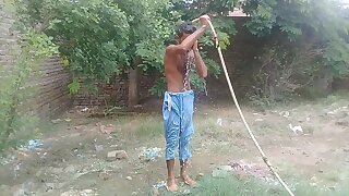 Pakistani villager bathing