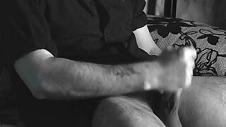The boy jerks off close-up with a condom and cums loudly into it&period;
