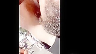 Bearded leather hunk sniffing a hairy pit