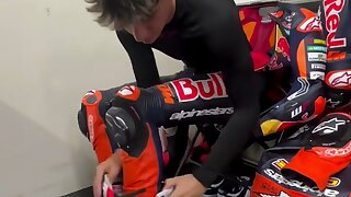 Watch this super cute professional racing biker in his leather gear.