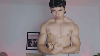 Hot young muscle guy flexes on can